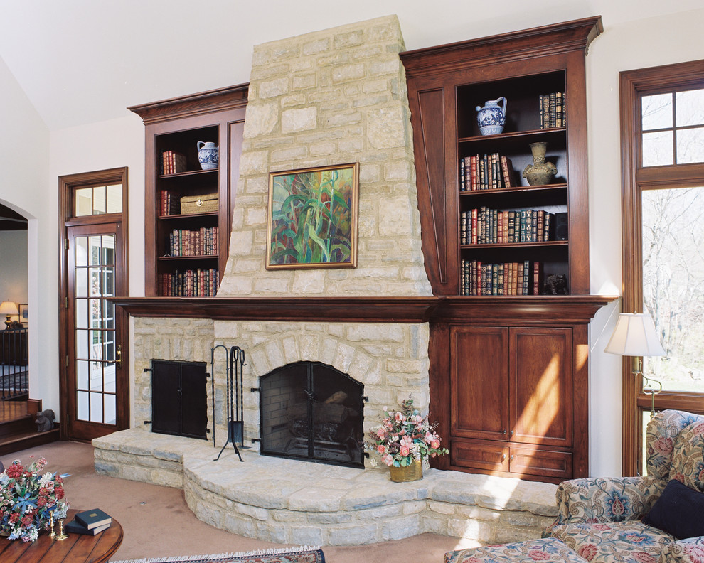  fireplace, bookshelf around fireplace, living room, white stone