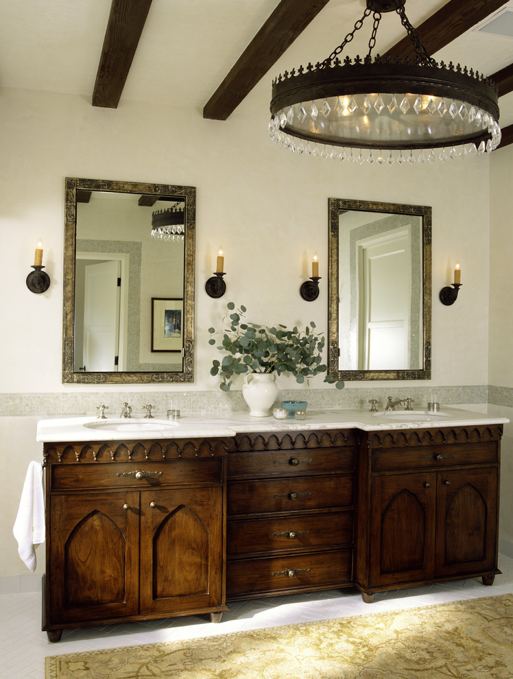 tommy chambers antique rustic vanity mediterranean-bathroom