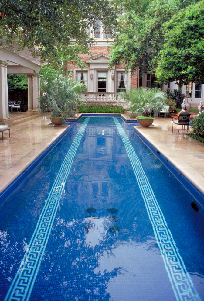 in ground pool backyard greek key tiles