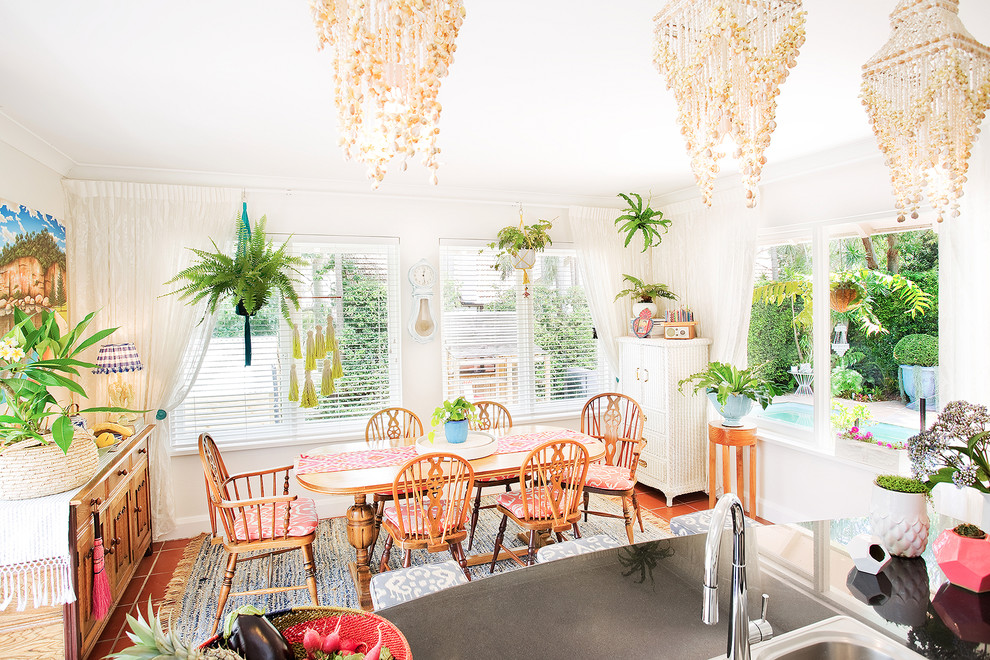 sea shell chandeliers venetian blinds hanging plants country style Eclectic-Dining-Room