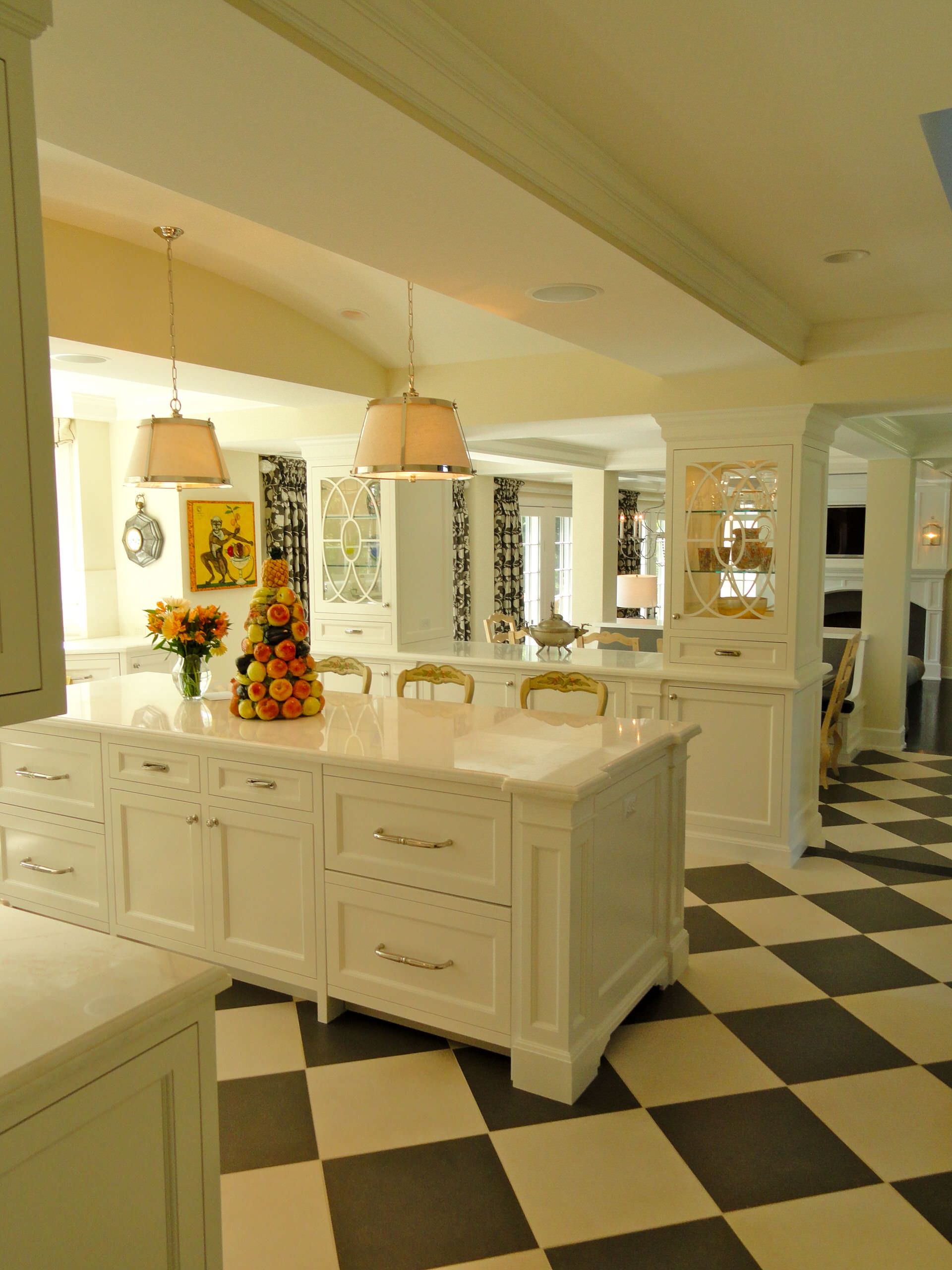 black and white titles kitchen white counter tops marble white cabinets open layout hanging lamps decorating