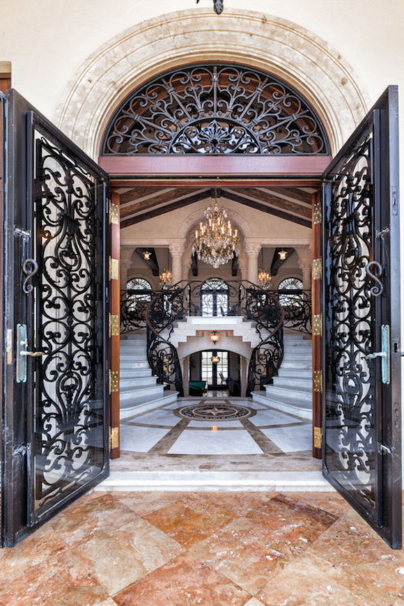 double door wrought iron entrance marble decor