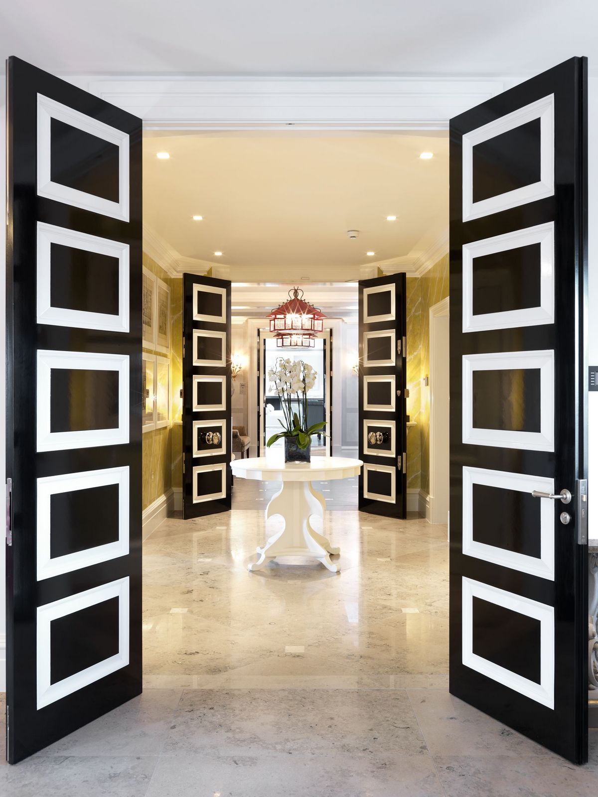 white black doors regency decor entrance marble tiles floor yellow white better decorating bible blog