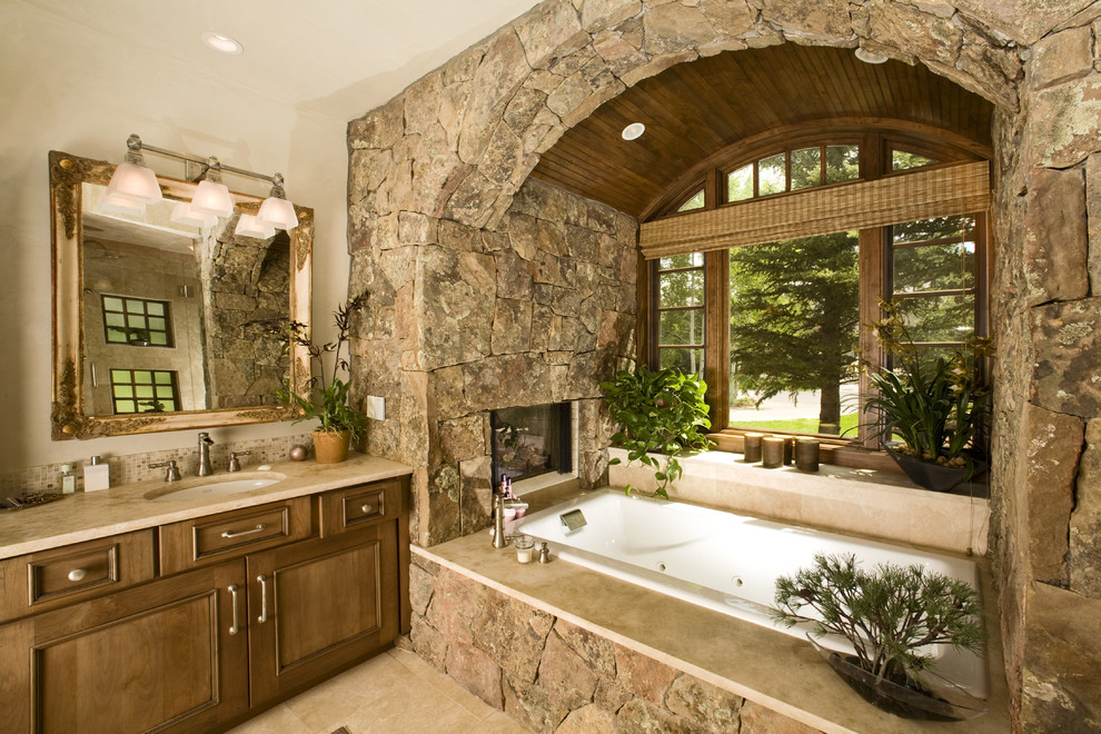 bathtub wall arch covered in river stone rocks country cottage style ranch house better decorating bible blog rustic interior