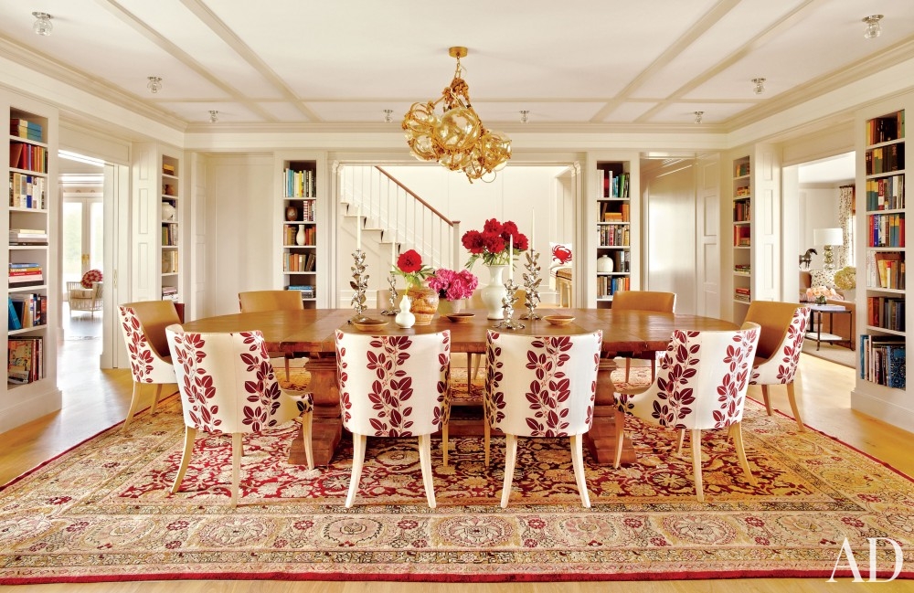 dining room bohemian persian carpet long wood table red white chairs built in bookcases in wall big house honey colored flooring better decorating bible blog artistic lamp chandelier