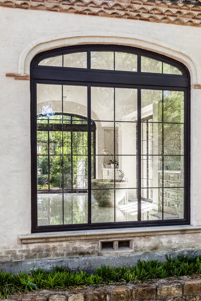 mediterranean-bathroom exterior windows black frame