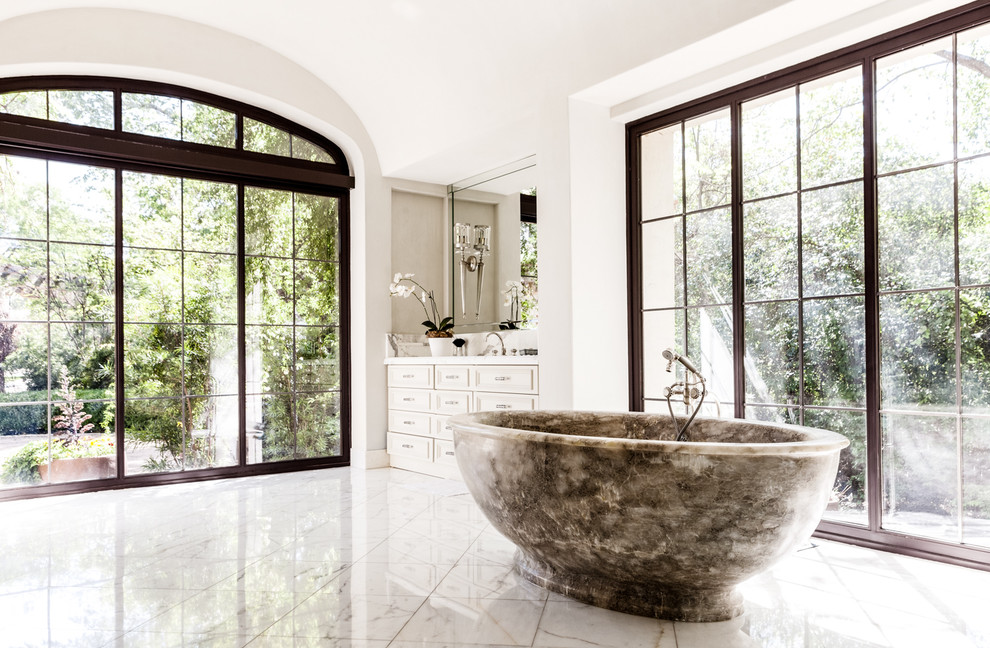 mediterranean-bathroom marble bath tub black frame windows