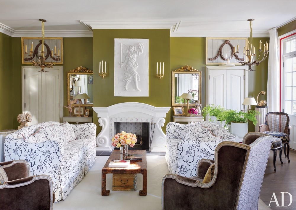 olive green walls living room gold lights scones white fireplace cuch slipcover better decorating bible blog gold gilded ornate mirros french style interiors