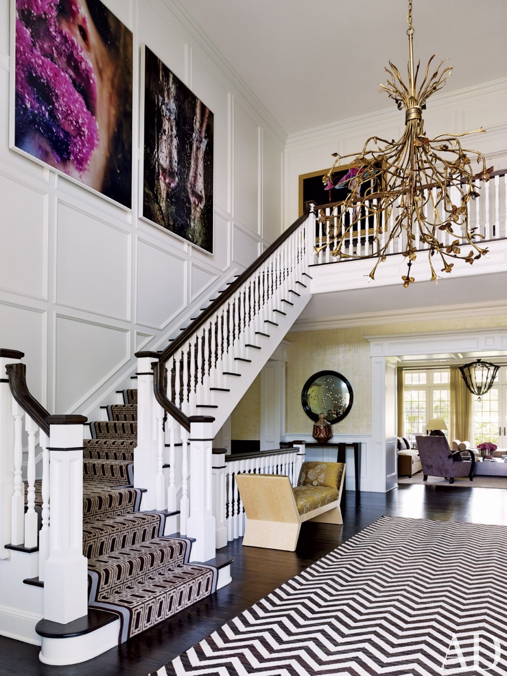 staircase white black dark brown moldings chevrun rug gold chandelier better decorating bible blog interiors