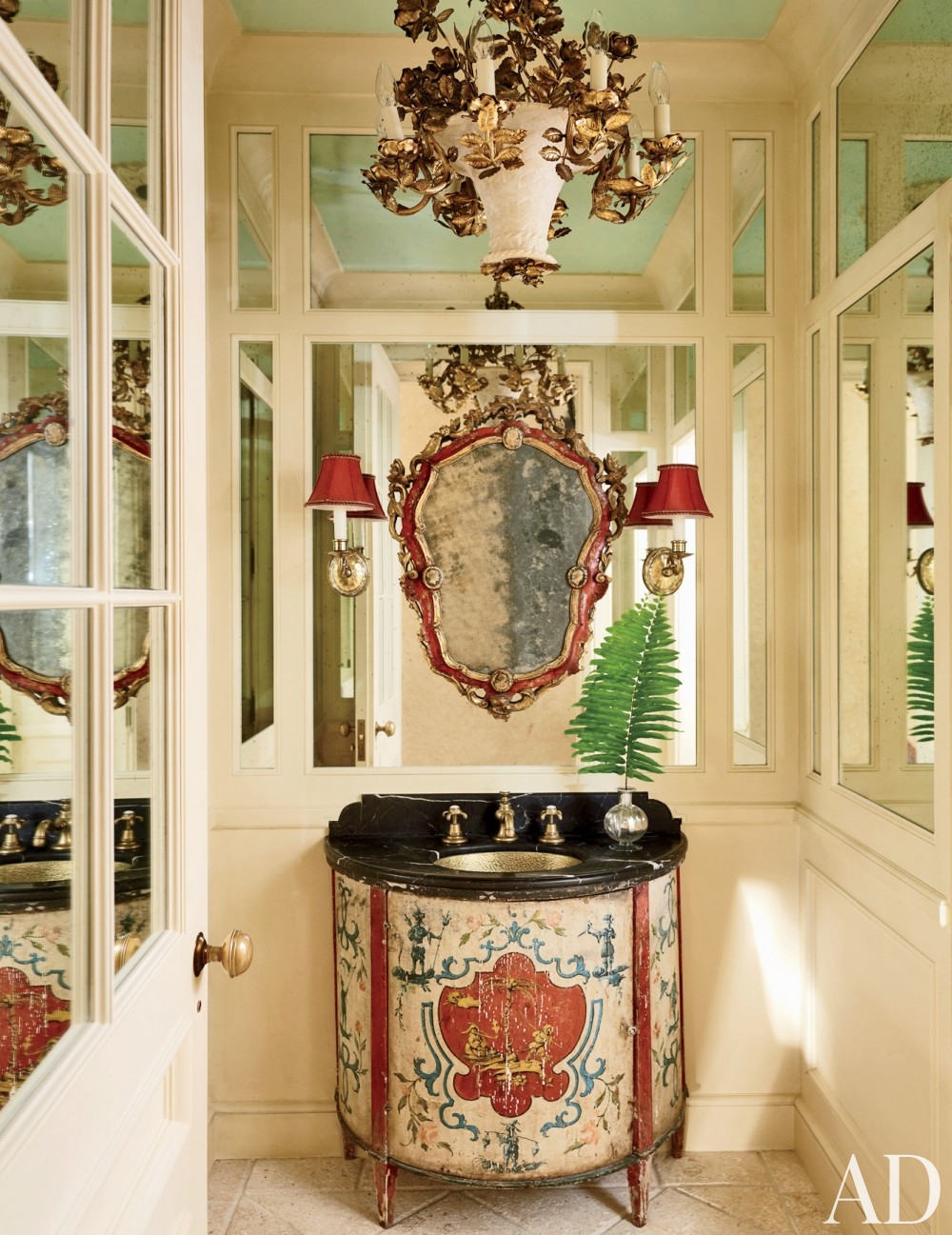 traditional-bathroom-david-easton-inc-palm-beach-florida mirrored wall panels scone lighting gold chandelier