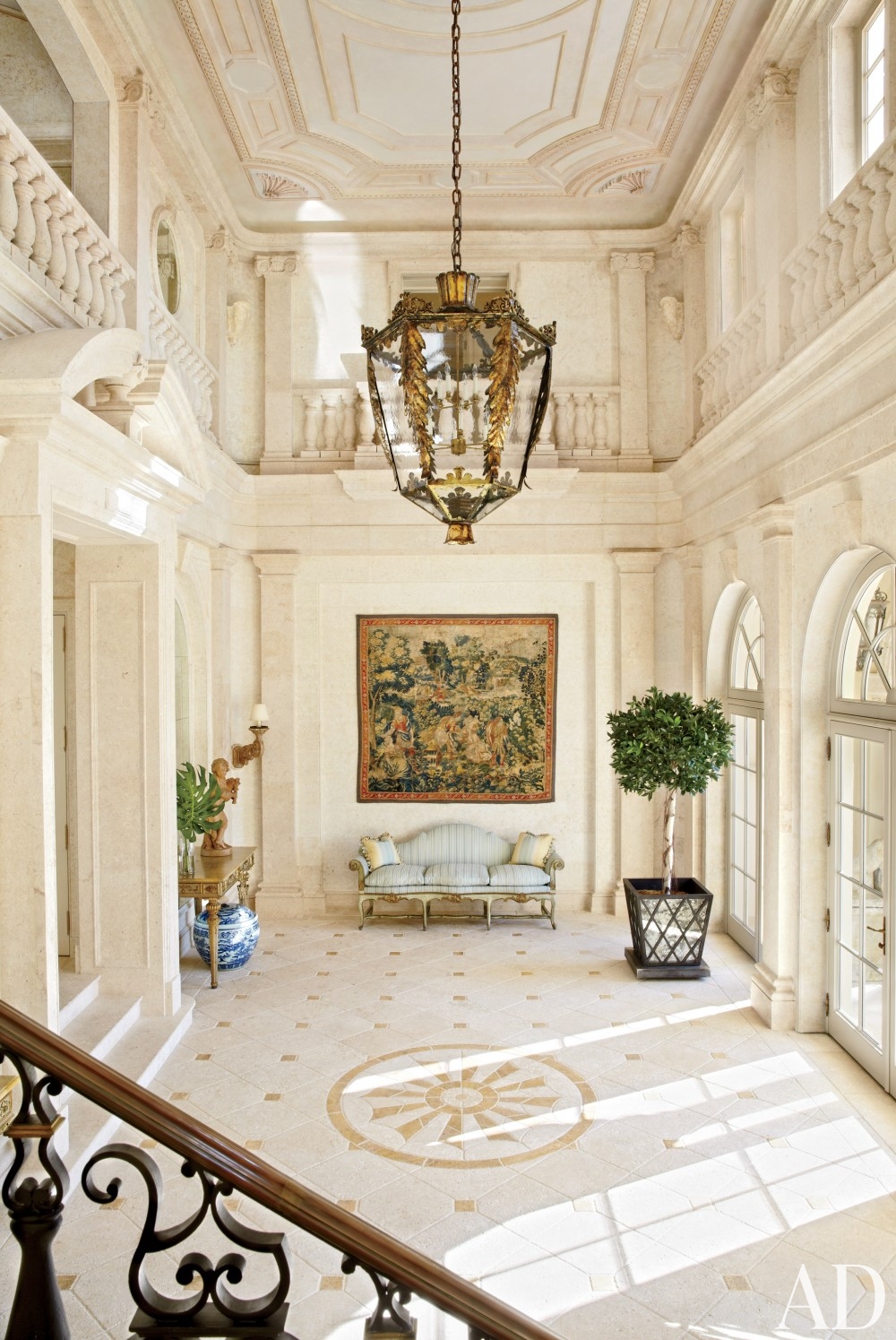 traditional-entrance-hall-david-easton-inc-palm-beach-florida foyer antique kilm on wall