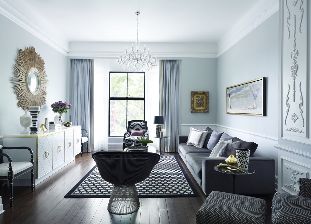 luxury dramatic apartment decor sunburt mirror velvet sofa chandelier grey walls