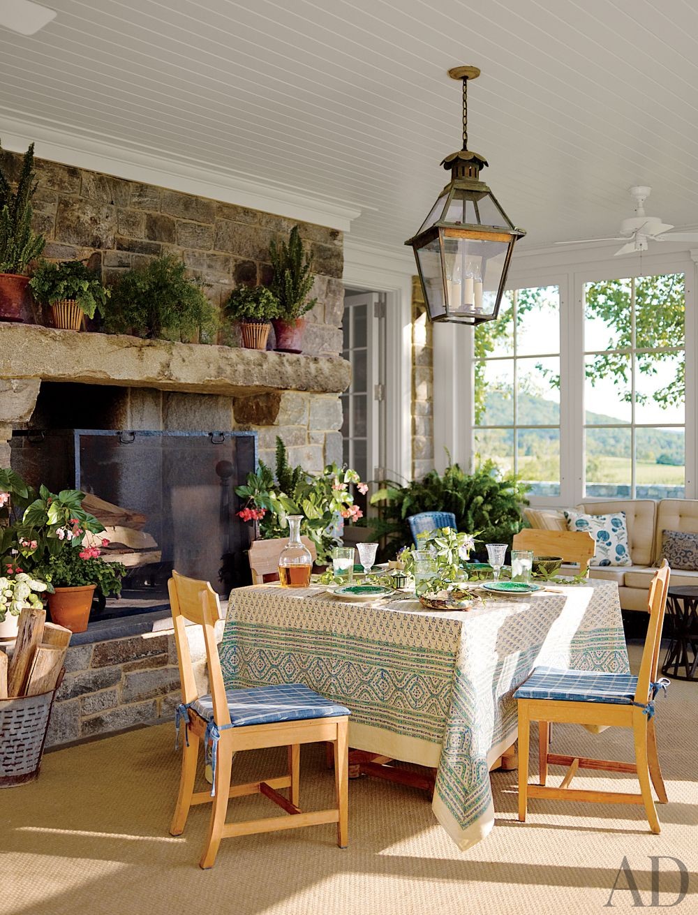 stone fireplace in sunroom decor