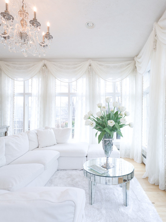 white bedroom mirrored coffee table fur carpet chandelier romantic decor
