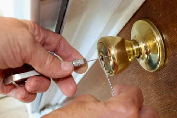 Hiring a locksmith to fix your door.