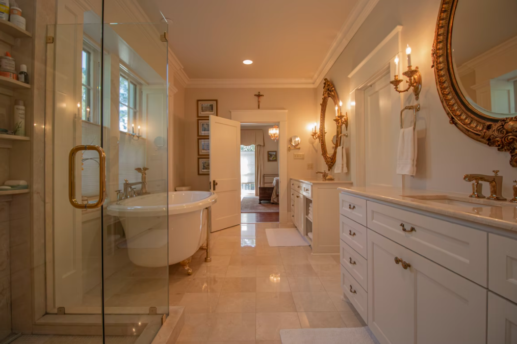 Bathroom with gold mirrors.